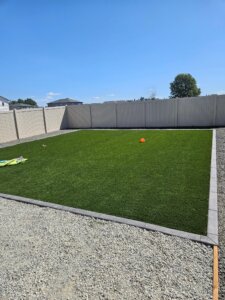 new residential landscaping, grass surrounded by gravel