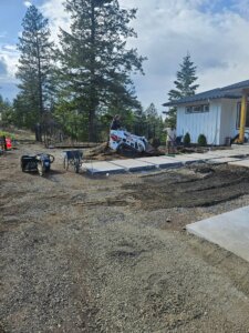 graveled residential landscape, with concrete walk blocks poured